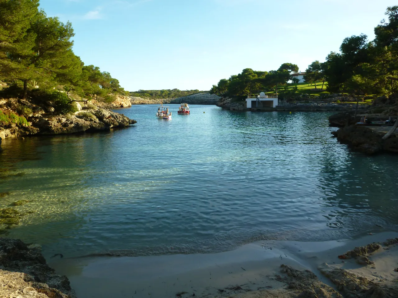 Turquoise water in the Cala Mitjana cove, Menorca