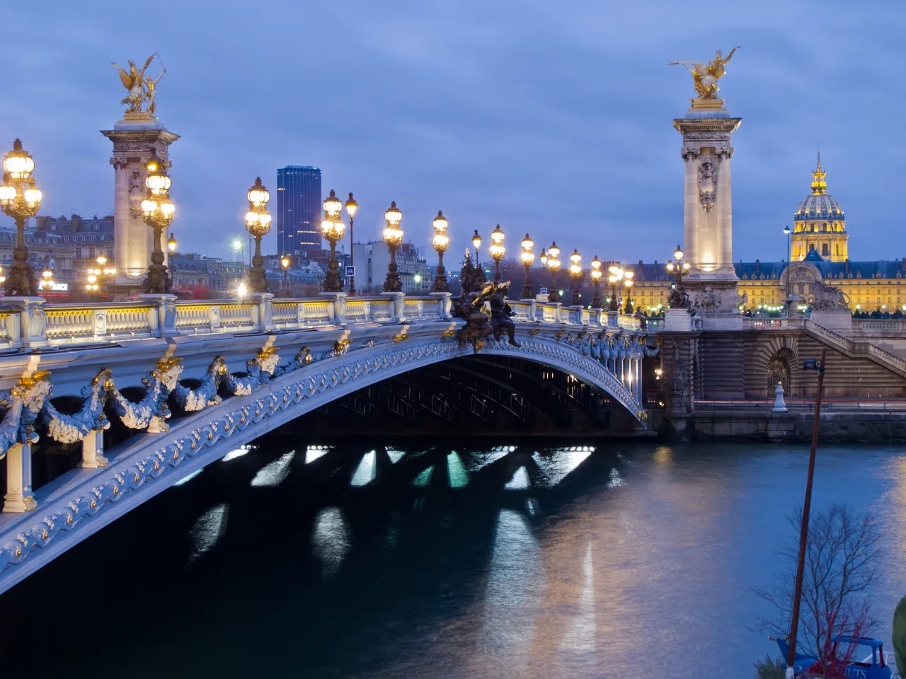 Pont Alexandre III lit up at blue hour over the Seine