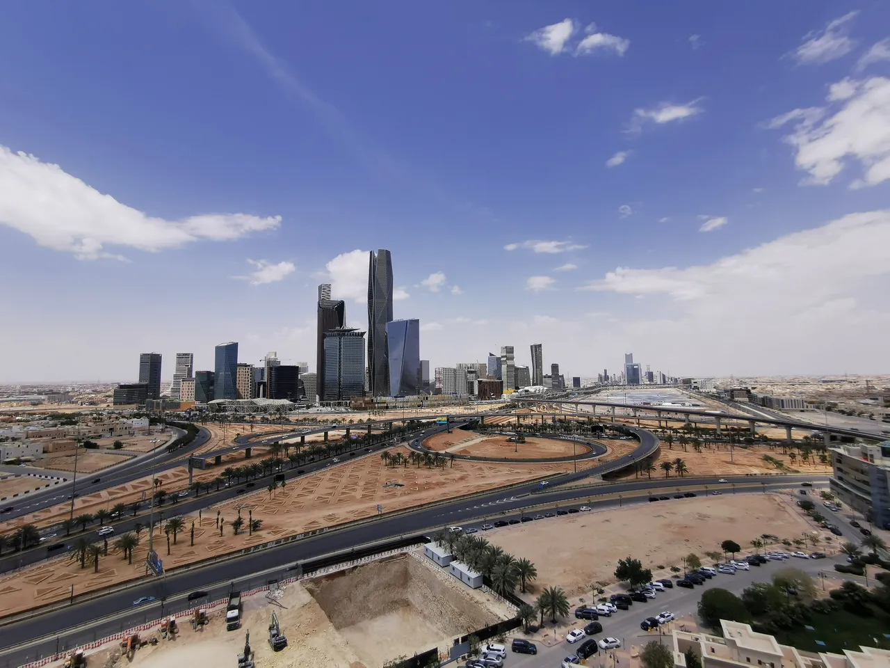 King Abdullah Financial District towers under a blue sky